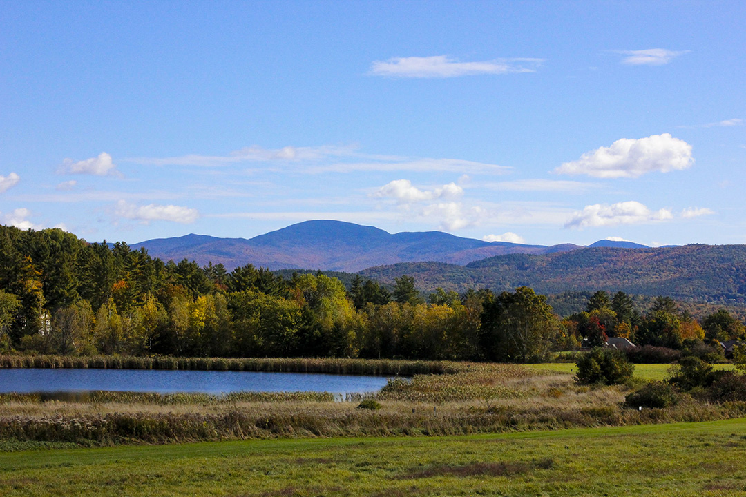 landscape mountain range with a pond infront