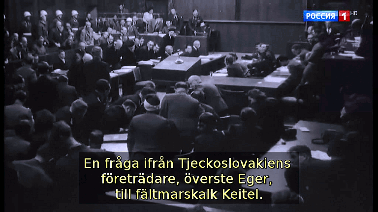 En fråga ifrån Tjeckoslovakiens företrädare, överste Eger, till fältmarskalk Keitel. (Bild ur filmen &laquo;Det stora okända kriget&raquo;)