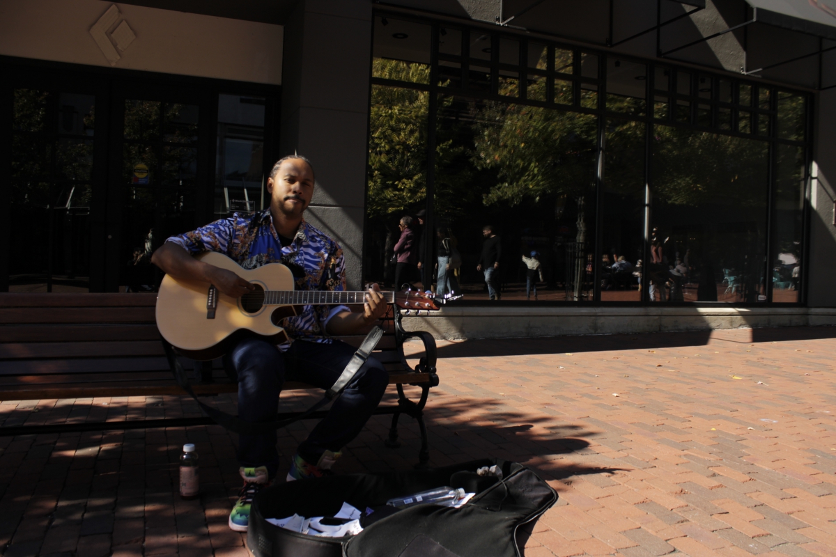 A man Playing guitar on church street