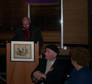 

Michael O'Riordan observed by Bob Doyle, the man with the hat and the cane.