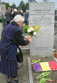 Flowers being laid on Ryans grave.