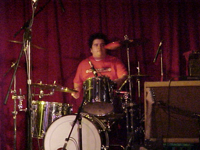 Darren bashing out the beats Ben doinghis best John Lennon impression