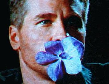 Montgomery with flower in mouth