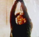 Simon hanging from chandelier