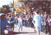 Cecil Pearce waiting to receive the Olympic flame from Jordana Blank
