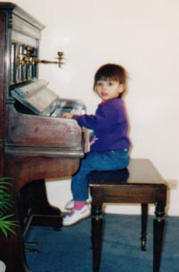 Olivia at Grandma Diane's piano.