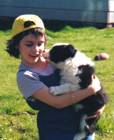 Olivia with grandma's and grandpa's puppy!&nbsp; Spring 2000.