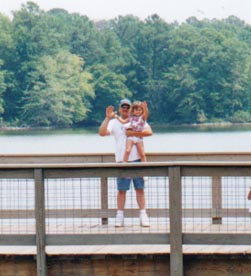 Stu holding Anna on the walk-over bridge!