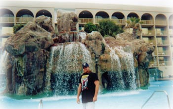 Donald by the waterfall where they stayed!&nbsp; Nice!