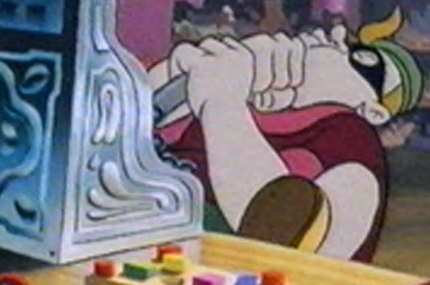 Bulk tries to open the toy shop's cash register with a rubber crowbar.