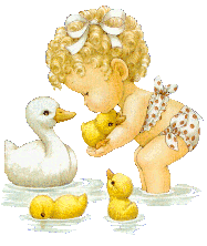 baby playing with ducks