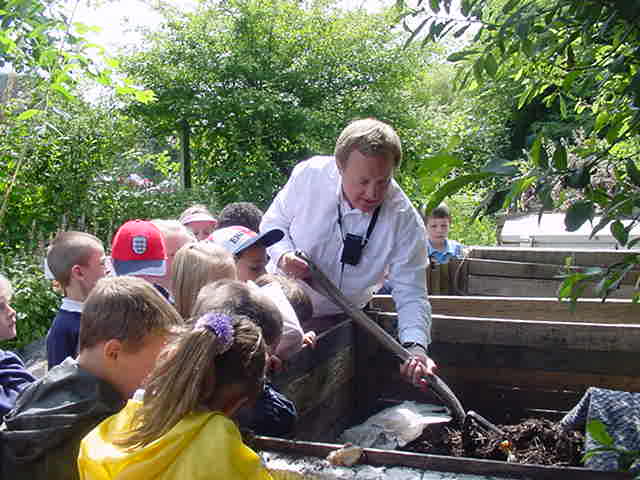 Mark forking the compost to reveal the bugs within