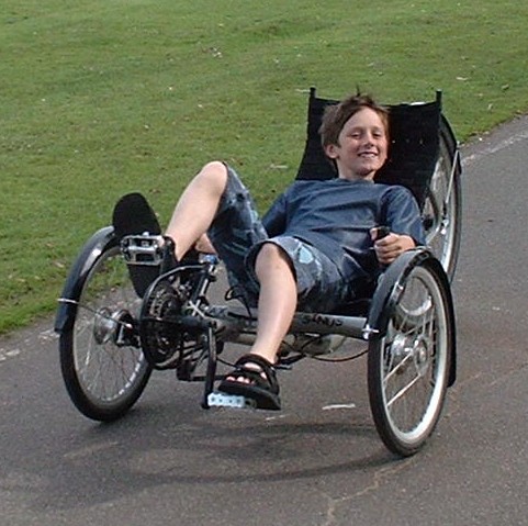 Daniel enjoying using the Recumbant bike