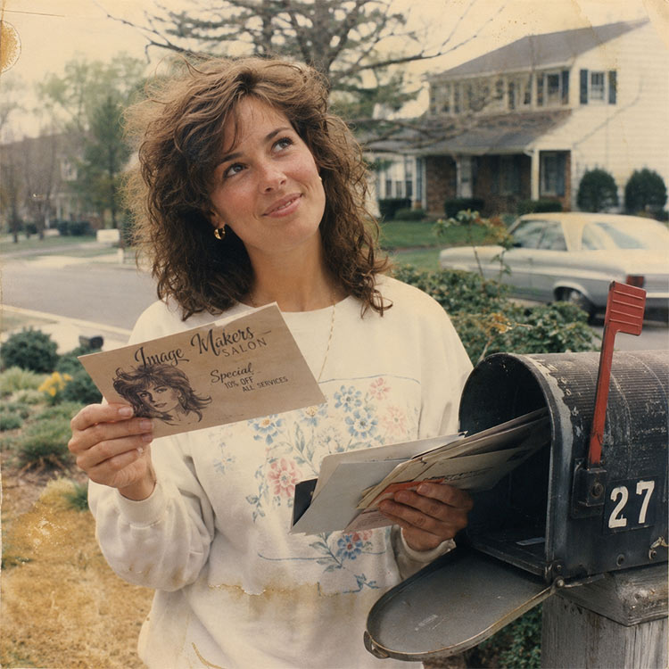 woman getting marketing postcard