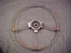 The guts of the steering wheel with the molded plastic ring chipped away from the wheel