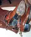 brown chaps and brown cowboy boots