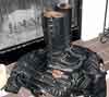 Engineer boots and motorcycle jacket still life