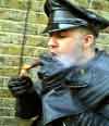 Gauntlets lighting a cigar