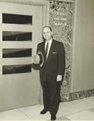James C. Gardner in front of his office
