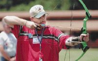 Brad Fry works on his archery technique at an event for hunters, campers and anglers with disabilities at the Andy Dalton Shooting Range & Training Center.
