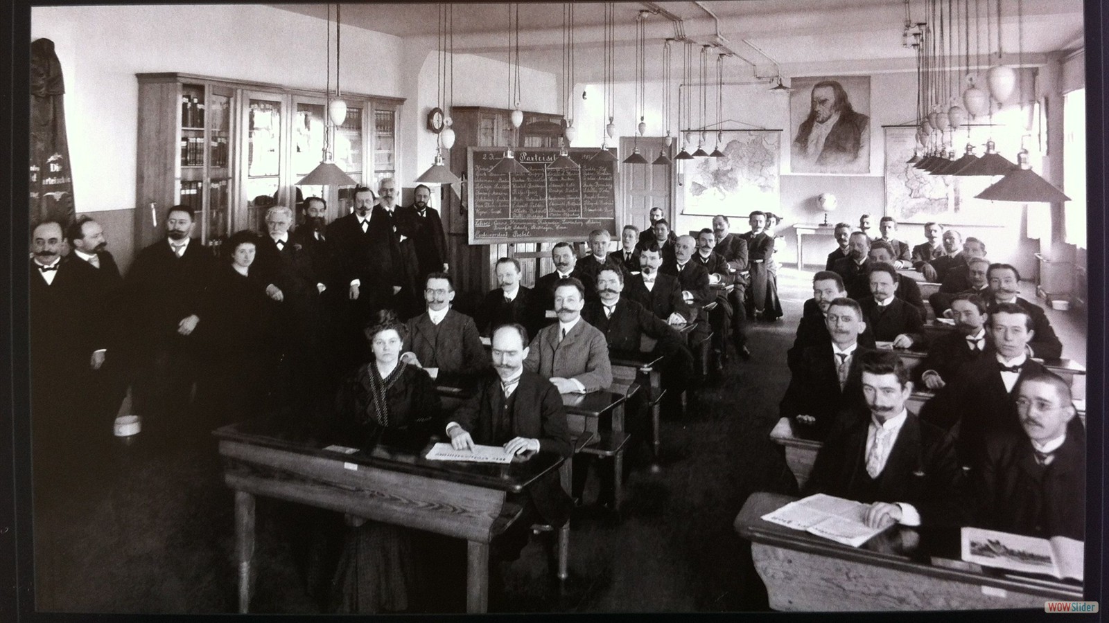 SPD Party Schoool, Berlin (1908): Rosa Luxemburg ( standing left), Wilhelm Pieck (seated to right of Luxemburg) and Friedrich Ebert (third row back on left-hand side of right row)